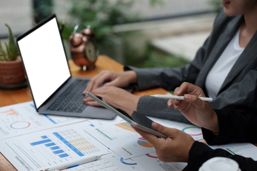 Fund managers team consultation and discuss about analysis Investment stock market by digital tablet